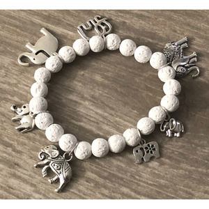 Charm bracelet with turtles and white lava beads